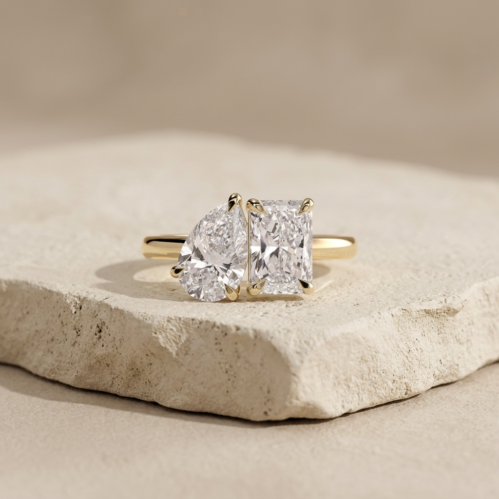 The Plot Twist toi et moi pear and radiant engagement ring in yellow gold, front view