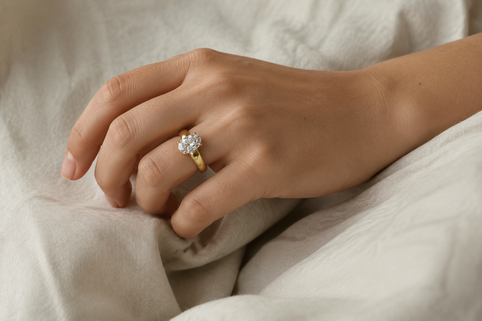 On the hand view of The Muse oval solitaire