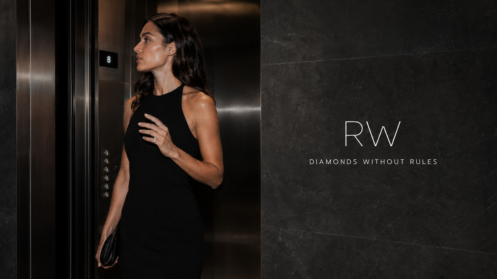 Woman in a black dress stepping from a lift wearing an RW diamond ring, beside the RW wordmark