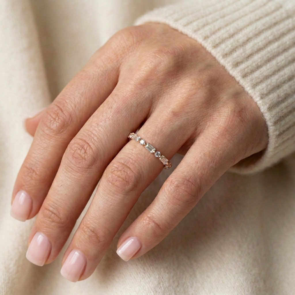 Natural hand in a cream knit wearing The Sequence diamond band